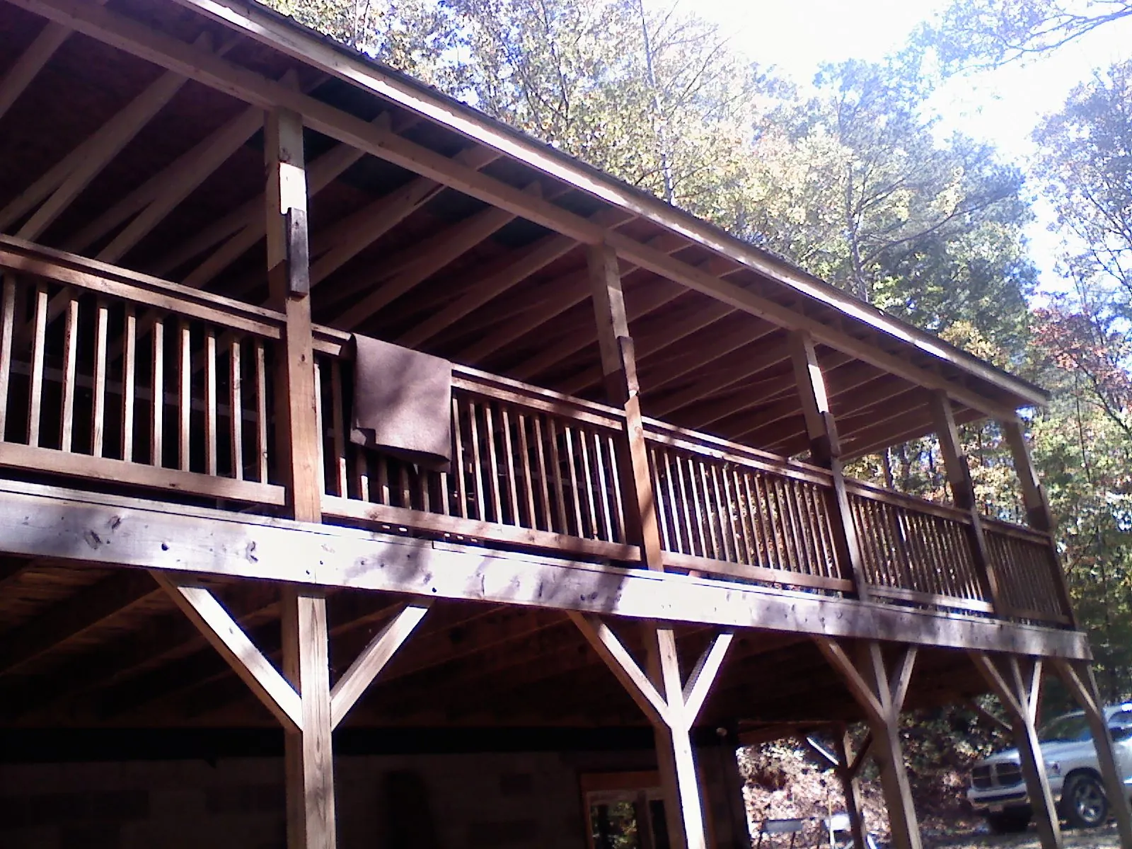 Timber framing under a new elevated porch and deck — Roof Leak Repair in Scipio Center by Roofing Brothers